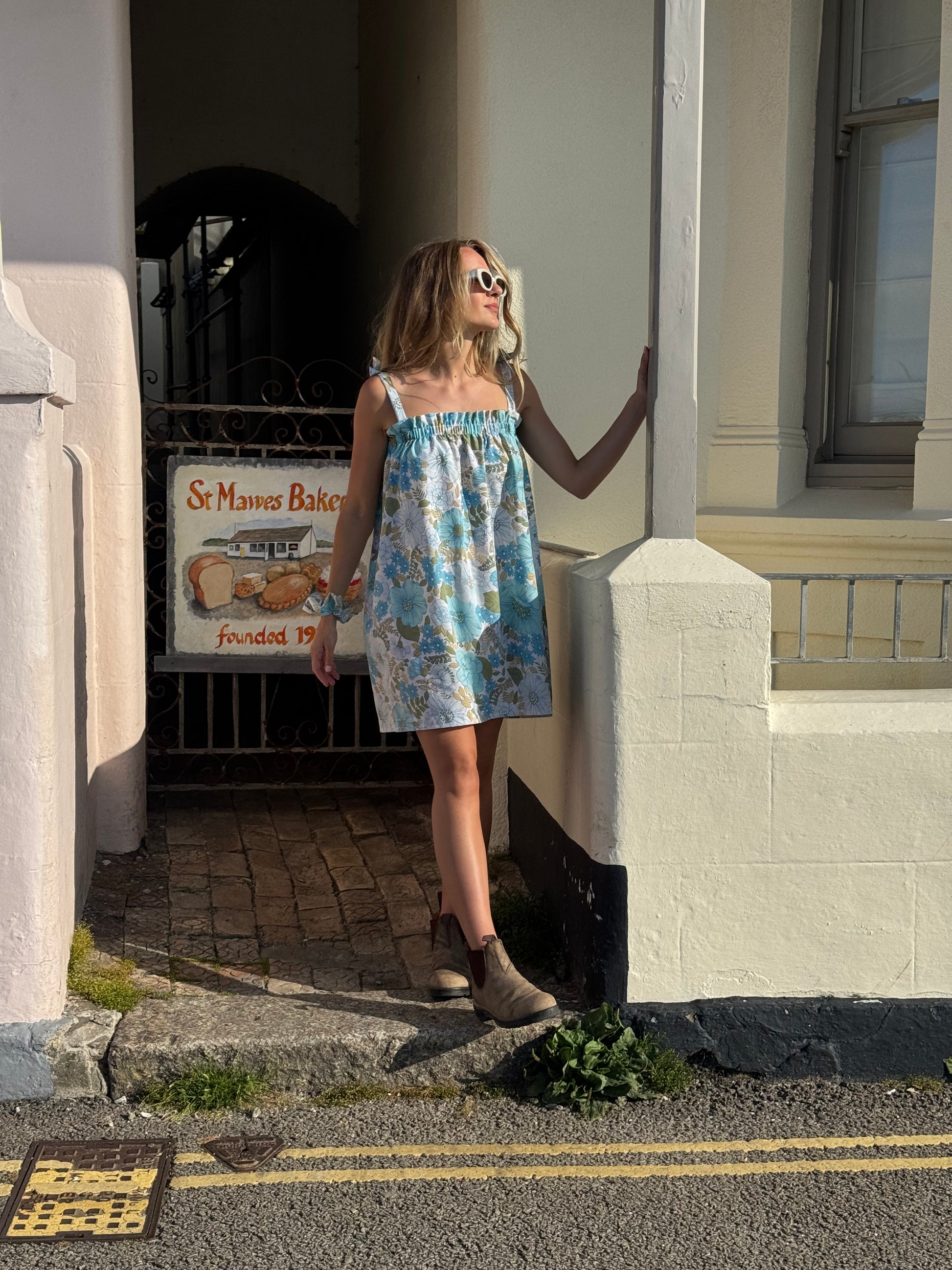 Girl in blue floral dress