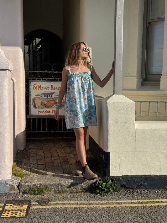Girl in blue floral dress