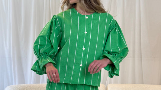 Upcycled green striped Remi top styled casually on model