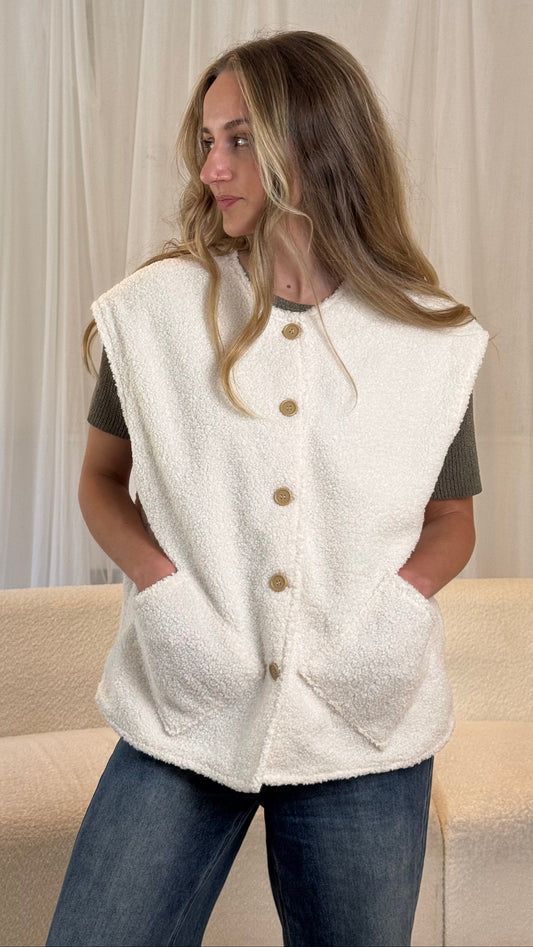 Upcycled cream gilet vest layered over a neutral outfit