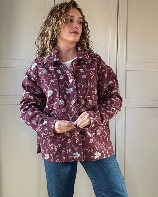 Woman wearing vintage floral jacket made from upcycled curtains, sustainable outerwear